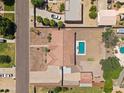 Aerial view of a single-Gathering home with a pool and spacious backyard in a well-maintained neighborhood at 22616 S 194Th St, Queen Creek, AZ 85142