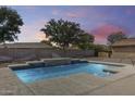 Beautiful pool area with custom water features, perfect for relaxation and enjoying outdoor living at 22616 S 194Th St, Queen Creek, AZ 85142