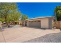 Single-story home featuring desert landscaping, a gravel yard, and neutral colored paint at 955 W Obispo Ave, Mesa, AZ 85210