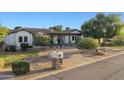 Charming single story home with a desert landscape, paver driveway, and manicured curb appeal at 21315 E Marsh Rd, Queen Creek, AZ 85142