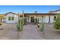 Beautiful single-story home with desert landscaping and a brick walkway leading to the front door at 21315 E Marsh Rd, Queen Creek, AZ 85142