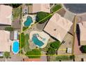 Aerial view of the property showcasing a large pool and landscaped backyard with a side yard area at 870 N Criss St, Chandler, AZ 85226