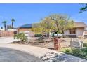 Beautiful single-story home with a two-car garage and solar panels on the roof at 10438 W Butler Dr, Peoria, AZ 85345