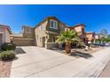 Charming two-story home with a desert-landscaped front yard, a palm tree, and a spacious driveway at 11979 W Pierce St, Avondale, AZ 85323