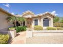 Inviting front entrance with stone walkway and desert landscaping at 16112 W Whitton Ave, Goodyear, AZ 85395