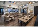 Spacious dining area with ample seating and picturesque views through expansive windows at 17160 W Montpelier St, Surprise, AZ 85388