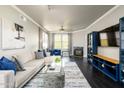 Stylish living room with a fireplace, ceiling fan, and contemporary furnishings at 19777 N 76Th St # 3229, Scottsdale, AZ 85255