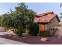Charming home featuring a well-maintained yard, terracotta roof, and desert landscaping at 2239 S Cottonwood --, Mesa, AZ 85202