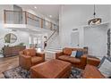 Bright living room with high ceilings and an open staircase to the second floor at 2305 E Millbrae Ct, Gilbert, AZ 85234