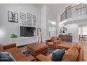 Inviting living room with high ceilings, ample natural light, and stylish decor at 2305 E Millbrae Ct, Gilbert, AZ 85234