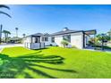 Beautiful single-story home with well-maintained lawn, modern design, and ample natural light at 2926 N 16Th Ave, Phoenix, AZ 85015