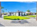 Beautifully renovated single-story home with manicured lawn, mature trees, and desert landscaping at 2926 N 16Th Ave, Phoenix, AZ 85015