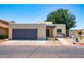 Charming single-story home with desert landscaping, private front courtyard, and a gray two-car garage at 3029 W Sierra St, Phoenix, AZ 85029
