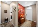 Inviting entryway featuring wood-look floors, neutral walls, and a decorative rug at 3117 S Signal Butte Rd # 484, Mesa, AZ 85212
