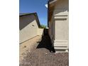 A view of the side yard with gravel landscaping at 3700 E Sandwick Dr, San Tan Valley, AZ 85140