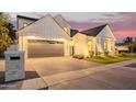 Striking two-story modern farmhouse boasting a lush front lawn, a gray garage door, and elegant exterior lighting at 4007 N 34Th St, Phoenix, AZ 85018