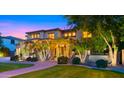 Charming entrance with stone pillars, palm trees, and warm lighting for a welcoming ambiance at 643 E Hopkins Rd, Gilbert, AZ 85295
