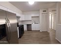 Updated kitchen featuring modern appliances, white cabinets, and sleek countertops, great for cooking and entertaining at 720 S Dobson Rd # 24, Mesa, AZ 85202
