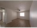 Inviting living room with wood flooring, ceiling fan, and natural light, ideal for comfortable living at 720 S Dobson Rd # 24, Mesa, AZ 85202