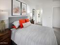 Serene bedroom featuring a comfortable bed, stylish decor, and natural light at 8950 W Albeniz Pl, Tolleson, AZ 85353