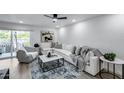 Bright living room features a modern sofa, stylish coffee table, and a large window for ample natural light at 3416 N 44Th St # 51, Phoenix, AZ 85018