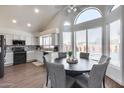 Bright eat-in kitchen with white cabinetry, stainless appliances, and large windows at 1266 S Harrington St, Gilbert, AZ 85233