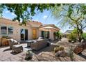 Outdoor seating area with decorative lighting, desert landscaping, and covered patio at 14037 E Coyote Rd, Scottsdale, AZ 85259