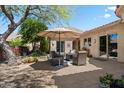 Outdoor seating area on a paver patio with decorative lighting, desert landscaping, and mountain views at 14037 E Coyote Rd, Scottsdale, AZ 85259