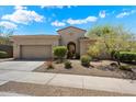 Single story stucco home with tile roof, low maintenance landscaping and mountain views at 14037 E Coyote Rd, Scottsdale, AZ 85259