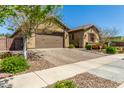 Inviting exterior showcasing desert landscaping and a two-car garage at 20592 E Reins Rd, Queen Creek, AZ 85142