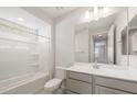Clean, bright bathroom features a shower and tub combo, a spacious vanity with drawers at 21352 N 271St Dr, Buckeye, AZ 85396