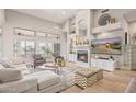 Bright living room with vaulted ceilings, fireplace, and ample natural light at 21474 N 56Th Ave, Glendale, AZ 85308