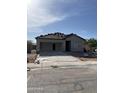 New home construction with a concrete driveway and in-progress roof at 25714 N Boreas Rd, Florence, AZ 85132