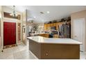 Bright, functional kitchen with stainless steel appliances, ample counter space, and a convenient island at 25821 N 41St Dr, Phoenix, AZ 85083