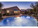 Sparkling backyard pool with a spacious patio area, perfect for entertaining or relaxing in the desert landscape at 25821 N 41St Dr, Phoenix, AZ 85083