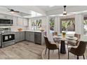 Updated kitchen with gray cabinetry, stainless steel appliances, and a view of the backyard pool at 2619 S Los Altos --, Mesa, AZ 85202