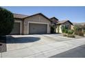 Lovely single story home features a three car garage and manicured desert landscaping at 27083 W Marco Polo Rd, Buckeye, AZ 85396