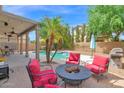 Inviting backyard with a covered patio, fire pit, and outdoor seating, ideal for relaxing at 2950 E Dublin St, Gilbert, AZ 85295