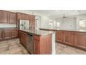 Spacious kitchen with stainless steel appliances, granite countertops, and a large island with bar seating at 3099 E Claxton Ct, Gilbert, AZ 85297