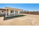 Large backyard featuring a covered patio and plenty of space for outdoor activities and relaxation at 3306 W Lupine Ave, Phoenix, AZ 85029