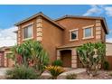 Charming two-story home with drought-tolerant landscaping and a cozy front porch at 41227 W Granada Dr, Maricopa, AZ 85138