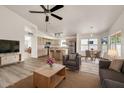 Open-concept living room featuring hardwood floors, a ceiling fan, and ample natural light at 4811 W Oakland St, Chandler, AZ 85226