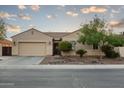 Charming single-story home with a well-manicured front yard and a two-car garage at 5208 S Gold Leaf Pl, Chandler, AZ 85249