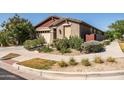 Charming single-story home with lovely desert landscaping and inviting curb appeal at 5616 S Caisson Way, Mesa, AZ 85212