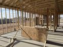 Interior view of a new home under construction displaying the wall and roof framing at 7713 W Avenida Del Rey --, Peoria, AZ 85383