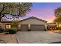 Charming home featuring a three-car garage and well-maintained landscaping in a desert setting at 9417 E Charter Oak Dr, Scottsdale, AZ 85260