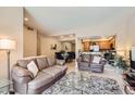 Open-concept living area features tile flooring, neutral paint, and seamless flow to dining and kitchen at 9708 E Via Linda -- # 1338, Scottsdale, AZ 85258