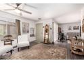 Inviting living room with neutral walls, sleek flooring, and stylish decor at 12201 S Paiute St, Phoenix, AZ 85044