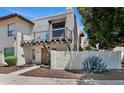 Charming two-story condo with a balcony, desert landscaping and a wood trimmed entry at 1826 E Frier Dr # 2, Phoenix, AZ 85020