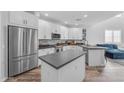 Modern kitchen featuring stainless steel appliances, center island, and elegant countertops at 2511 W Queen Creek Rd # 474, Chandler, AZ 85248